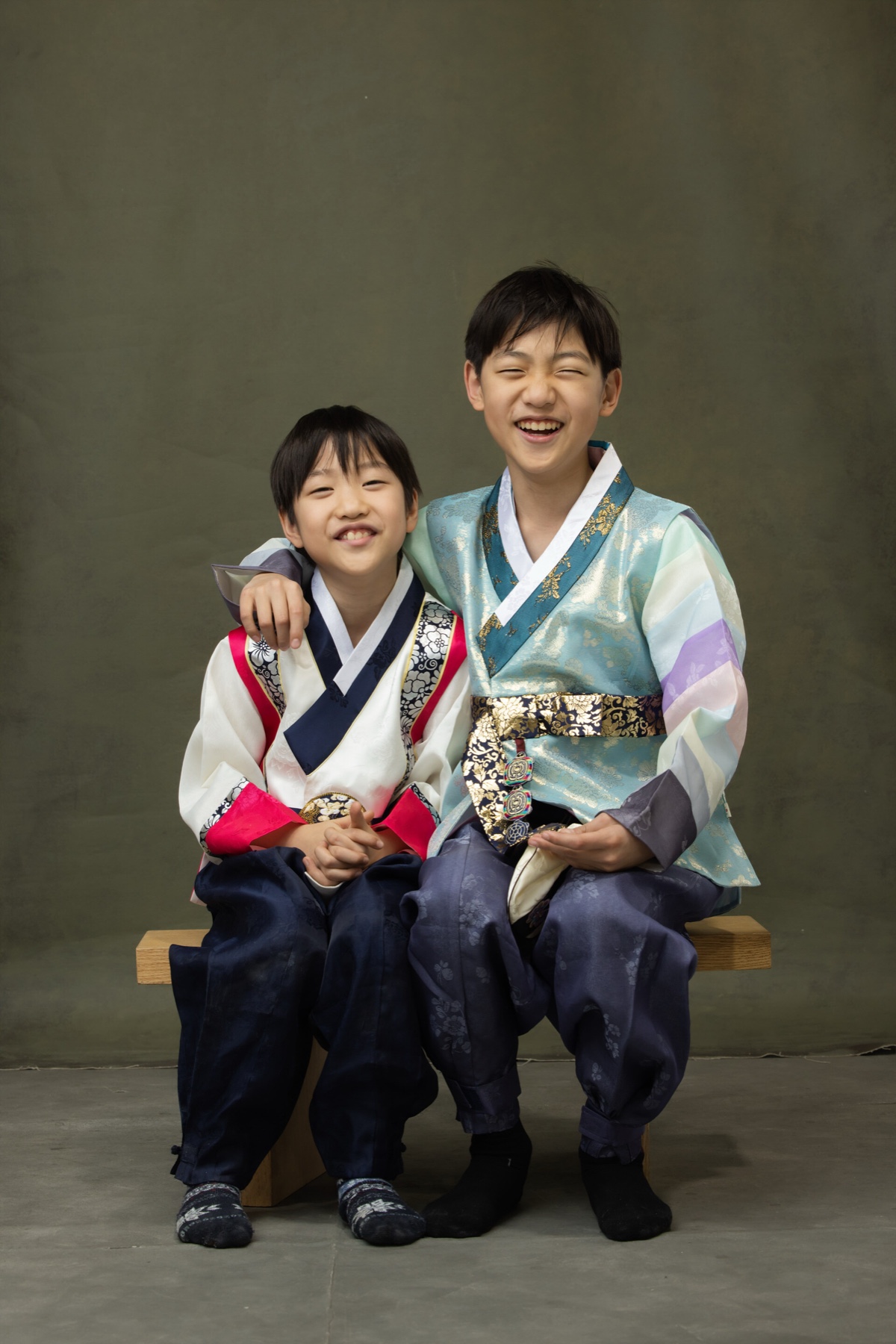 Two brothers in hanbok smiling together