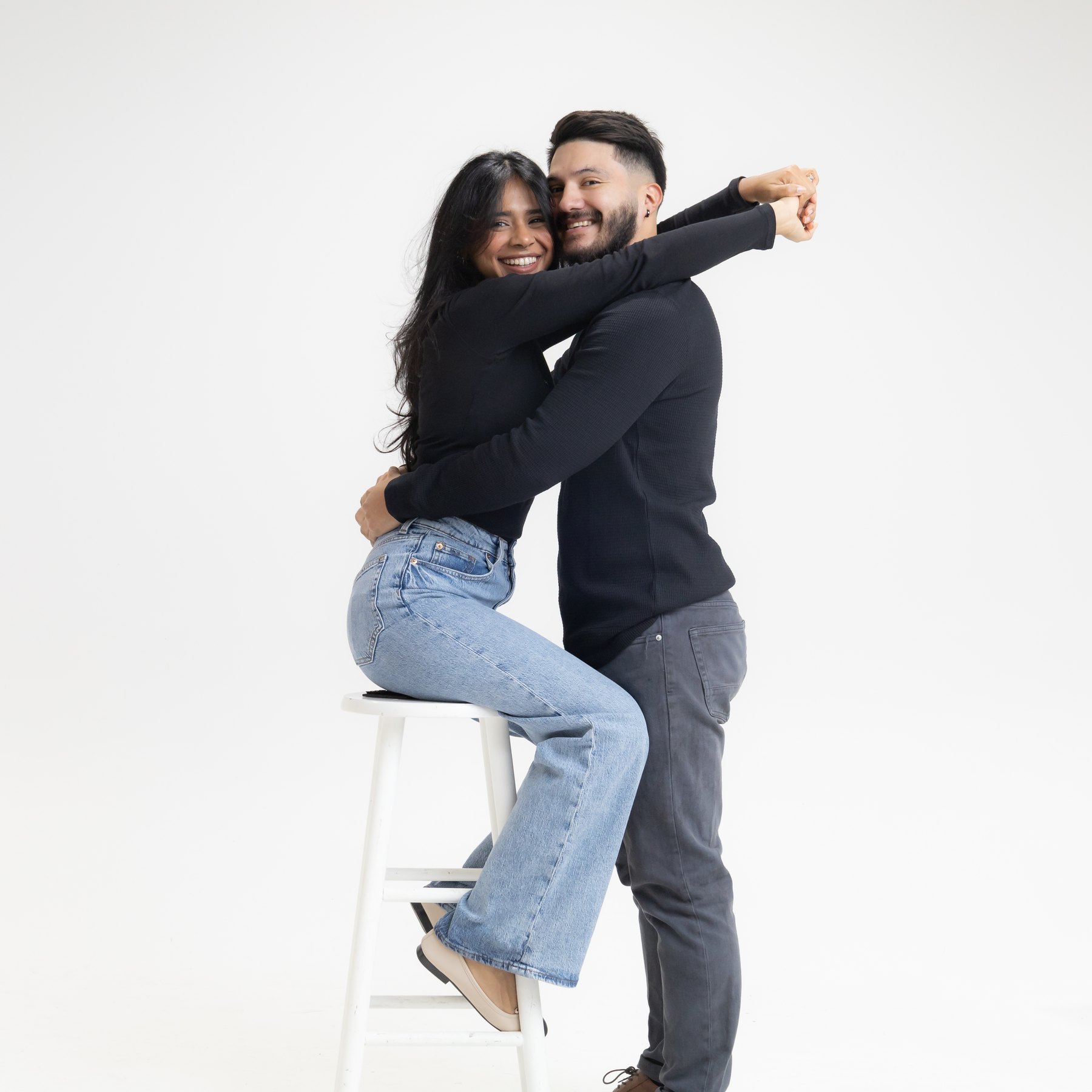 Arianny and her partner embracing in the self-portrait studio