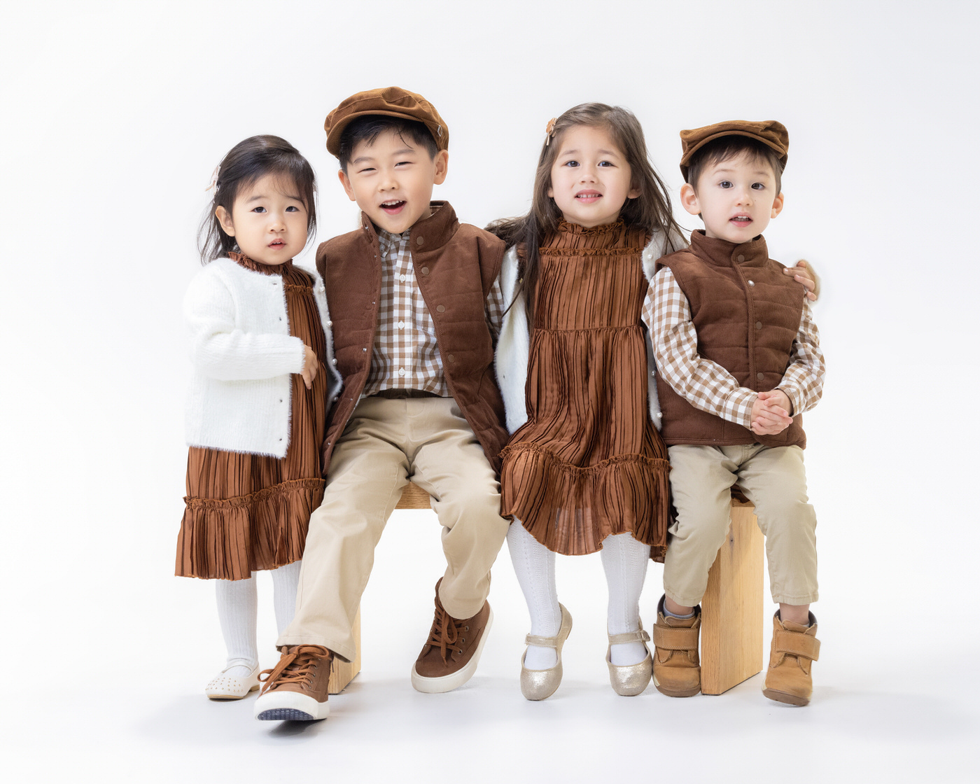 Four children together in a studio portrait
